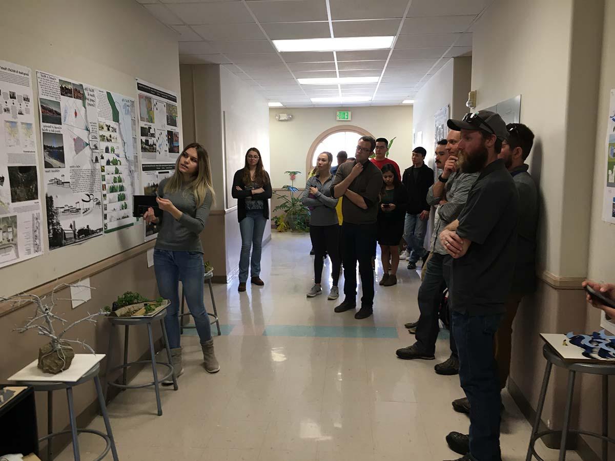 Students in hall for critique of work